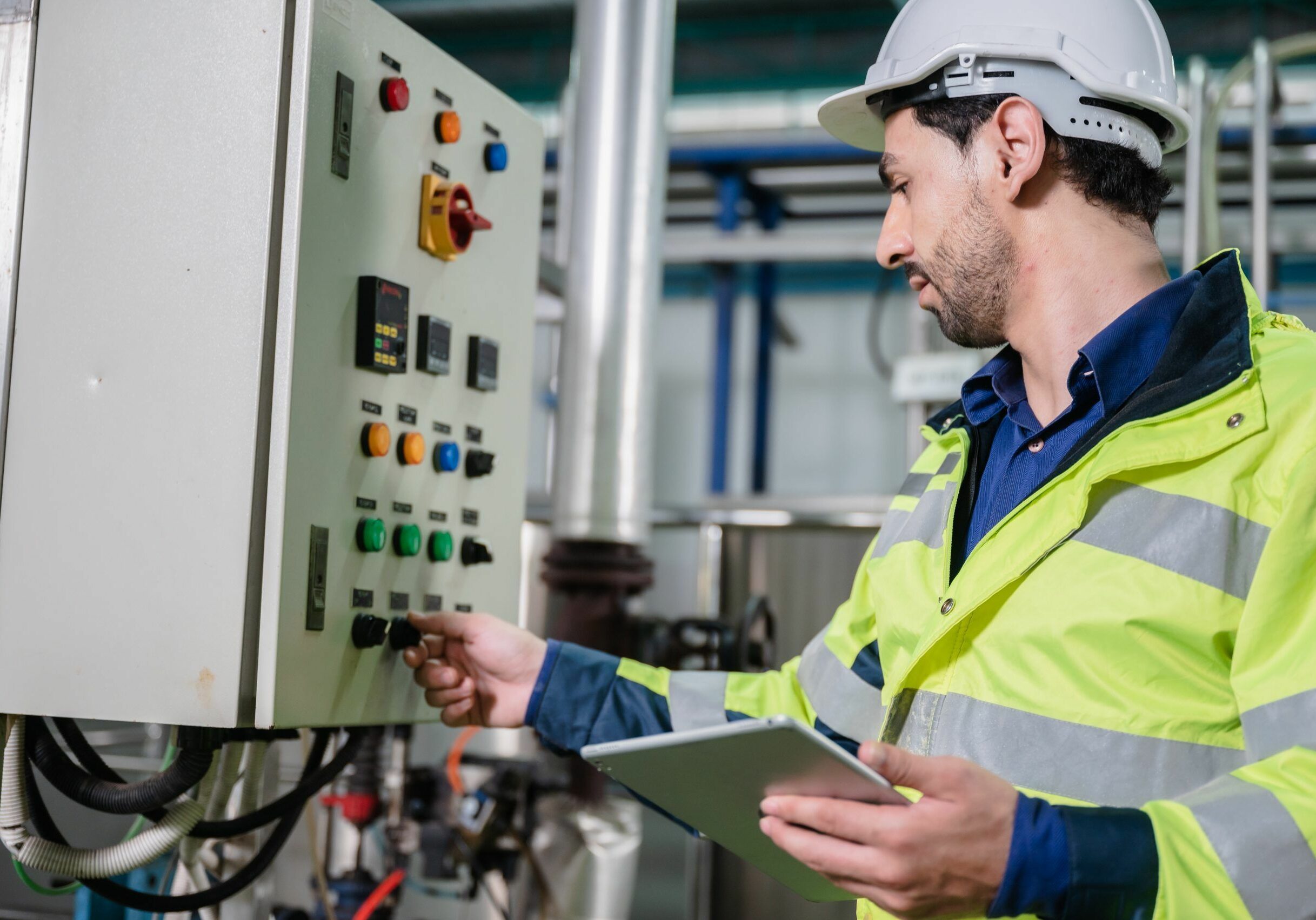 professional technician engineer working to control electrical power and safety service system, electrician working to maintenance and checking industrial equipment in term of factory technology